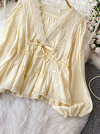 Lace detail V-neck blouse dress from Trendsi featuring a fitted silhouette and elegant design, shown on a model.