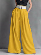Shopimist high-waisted wide-leg pants with a relaxed fit, featuring a smooth fabric and a stylish, modern silhouette.