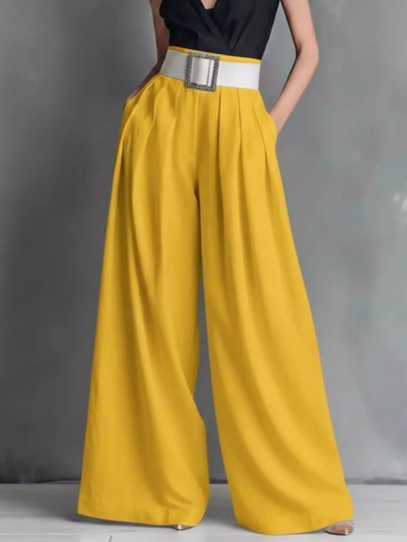 Shopimist high-waisted wide-leg pants with a relaxed fit, featuring a smooth fabric and a stylish, modern silhouette.