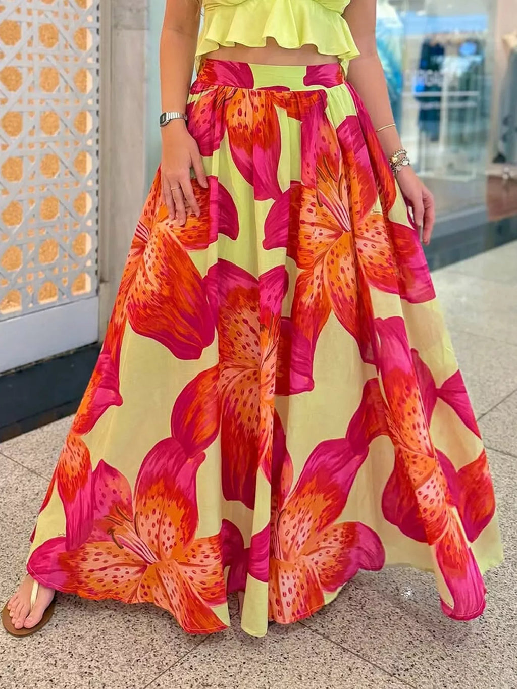 Women's floral print flowy maxi skirt with pockets, lightweight boho style from Trendsi, shown in a natural, relaxed pose.