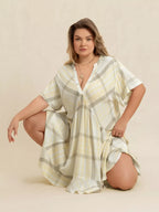 Plus size plaid flutter sleeve dress by Shopimist, featuring a stylish plaid pattern and flowy flutter sleeves.