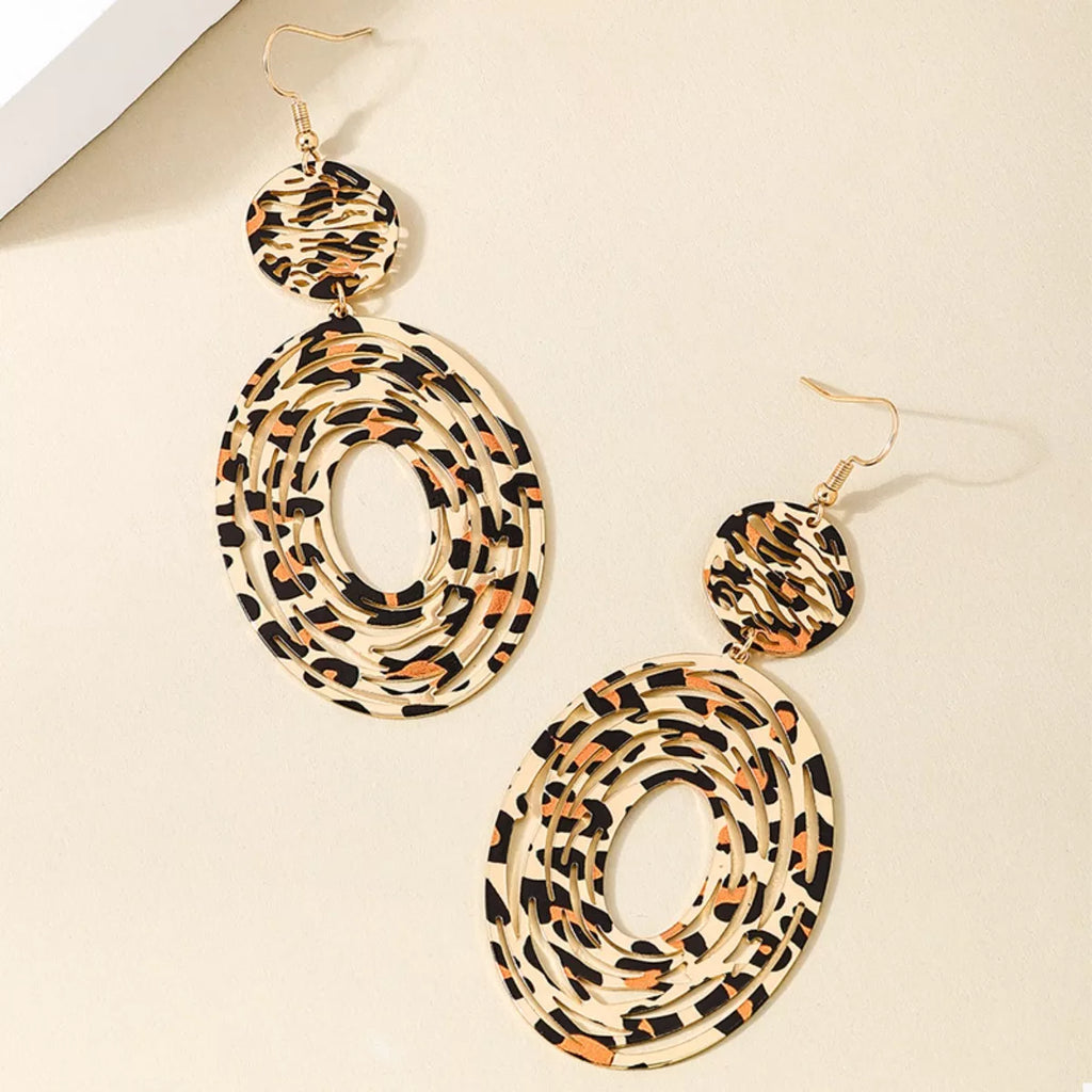 Leopard print dangle earrings from Shopimist featuring gold hooks and bold animal print design.
