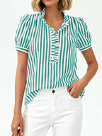 Women's striped puff sleeve blouse with ruffled details, featuring a stylish and feminine design by Trendsi.