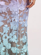 Floral embroidered tube maxi dress by Shopimist featuring vibrant flower patterns and a fitted bodice with flowing skirt.