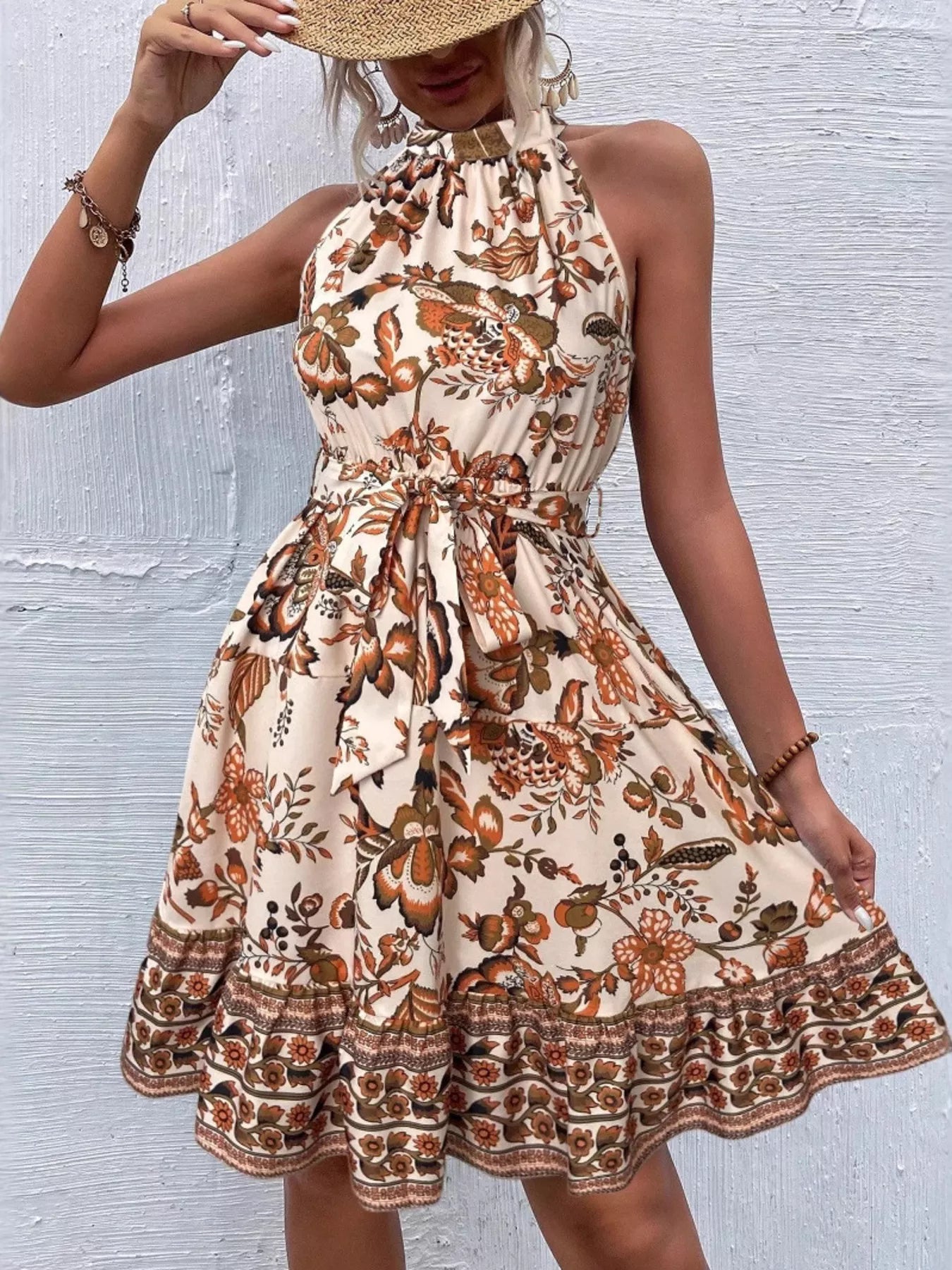 Printed sleeveless tie waist dress by Shopimist featuring a flowy design and stylish pattern, perfect for casual or summer wear.