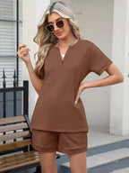 Solid color short sleeve top and shorts two-piece set by Trendsi, casual summer outfit for women, lightweight and comfortable.