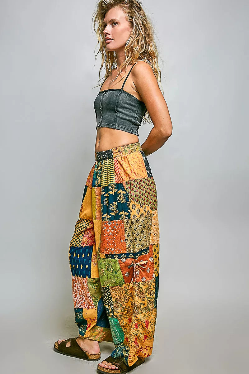 Printed patchwork wide leg cotton pants with side drawstring, designed as a relaxed trendy dress style.