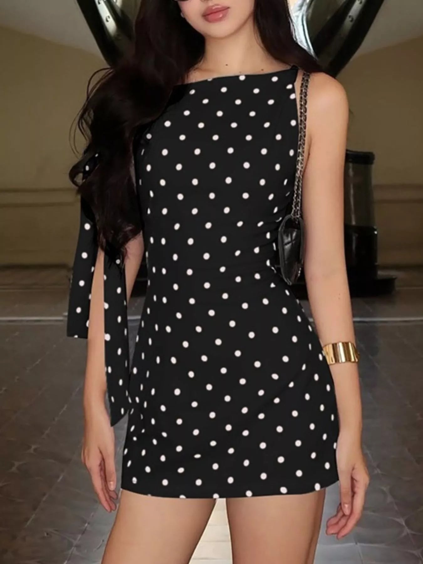 Polka dot sleeveless mini dress with bow accents by Shopimist, showcasing a stylish dress with a playful pattern and feminine details.