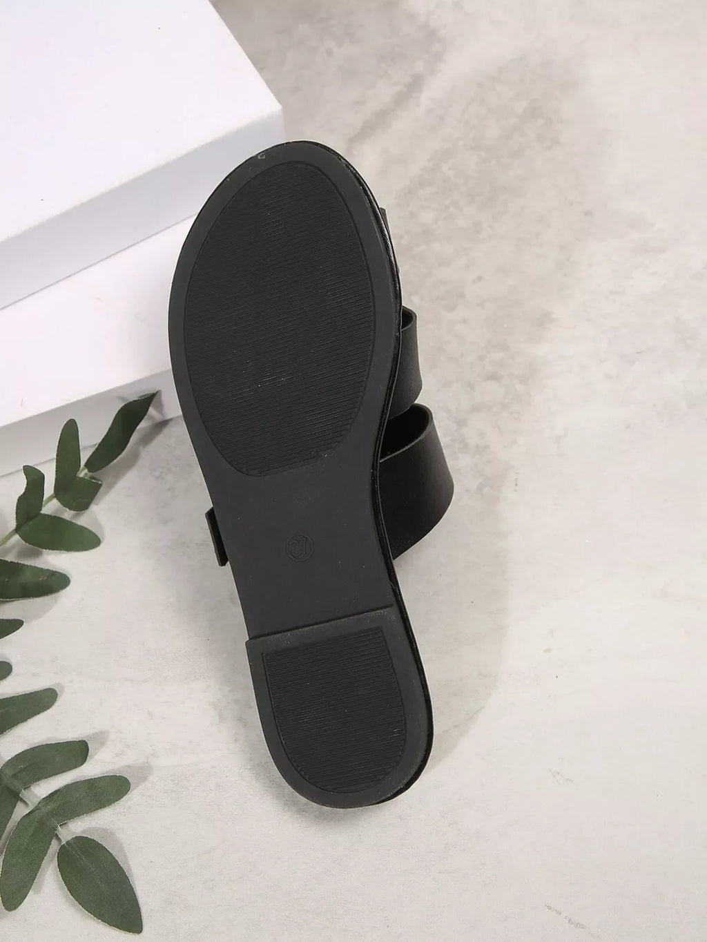 Comfortable slip-on leather sandals with adjustable buckle, featuring a sleek design and cushioned footbed for all-day wear.