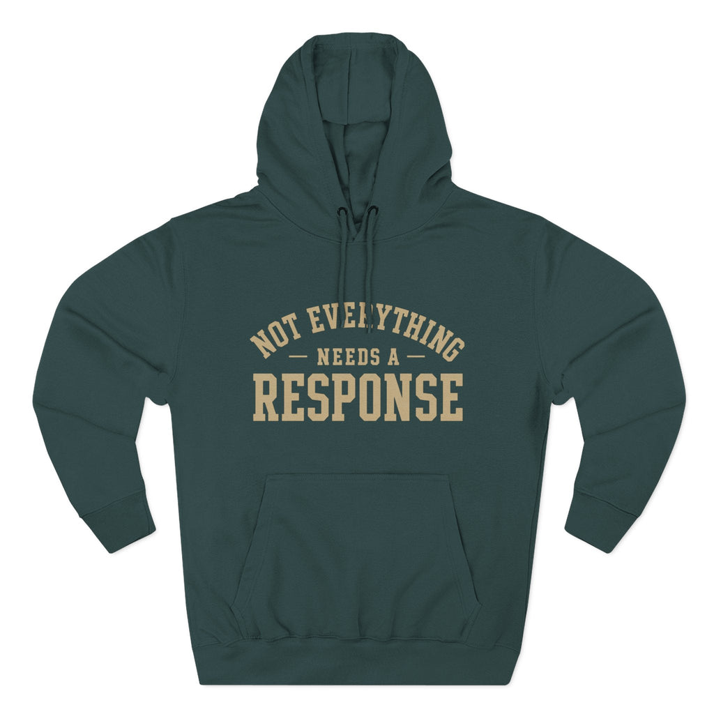 Black hoodie from Wear Your Worship's Not Everything Needs a Response Identity Line with printed text, casual fit, and drawstring hood.