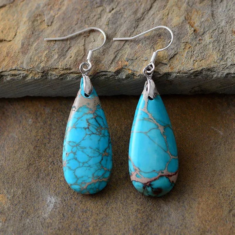 Natural stone copper teardrop earrings with elegant design, featuring warm copper and smooth teardrop-shaped stones.