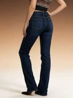 High-waisted bootcut denim jeans by Plush Fashion Shop displayed on a model, showcasing their fit and classic blue wash.