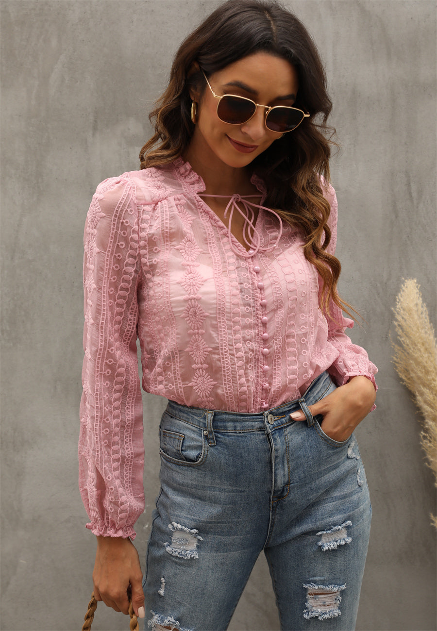 Bella Mia women's long sleeve V-neck shirt with floral embroidery and wood earrings, featuring a stylish and feminine design.