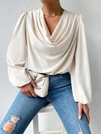 Loose draped long sleeve V-neck top for women by Bella Mia, featuring a relaxed fit and casual style.