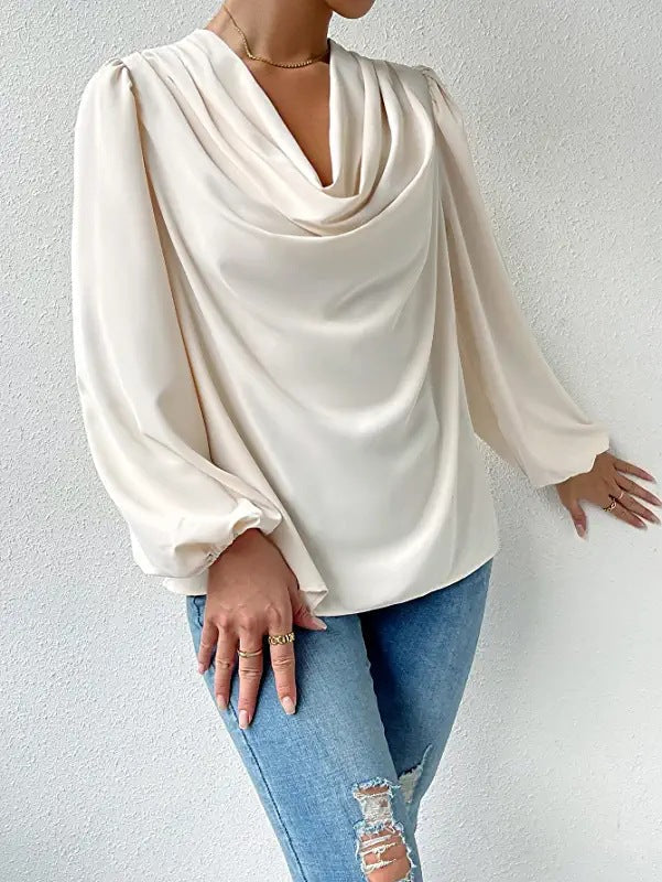 Loose draped Bella Mia long-sleeved V-neck shirt for women, featuring a relaxed fit and casual style.
