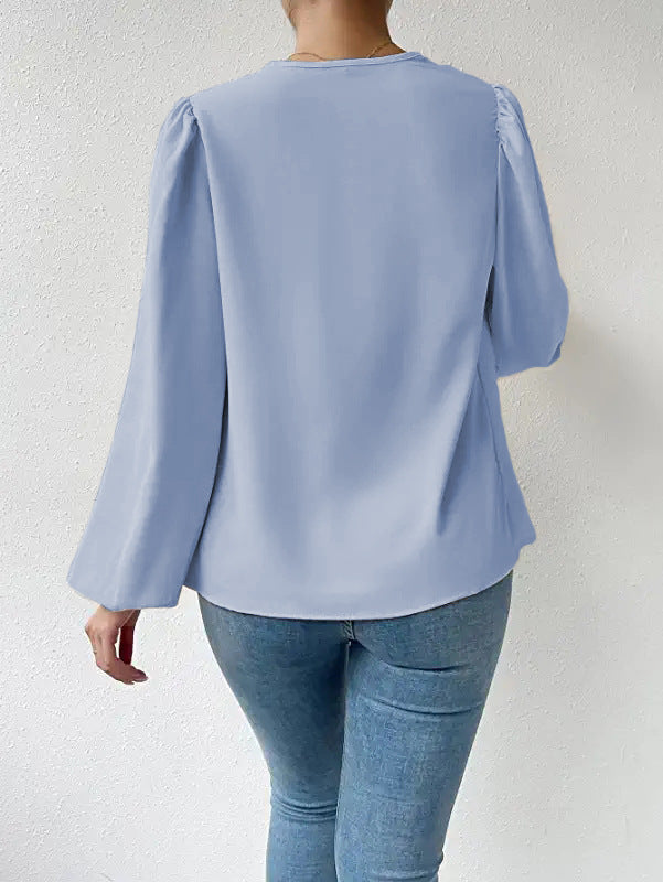 Loose draped Bella Mia long-sleeved V-neck shirt for women, showcasing a relaxed fit and stylish design.