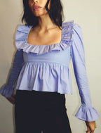 Bella Mia summer wind women's solid color long sleeve ruffled shirt, lightweight and stylish for warm weather.