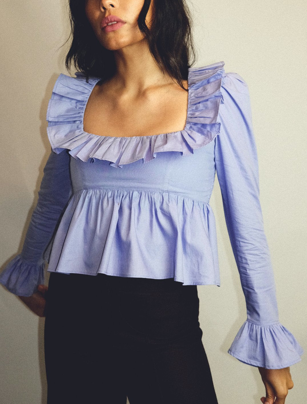 Bella Mia summer wind women's solid color long sleeve ruffled shirt, lightweight and stylish for warm weather.