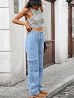 High-waisted cargo denim jeans from Plush Fashion Shop featuring multiple pockets and a relaxed fit.
