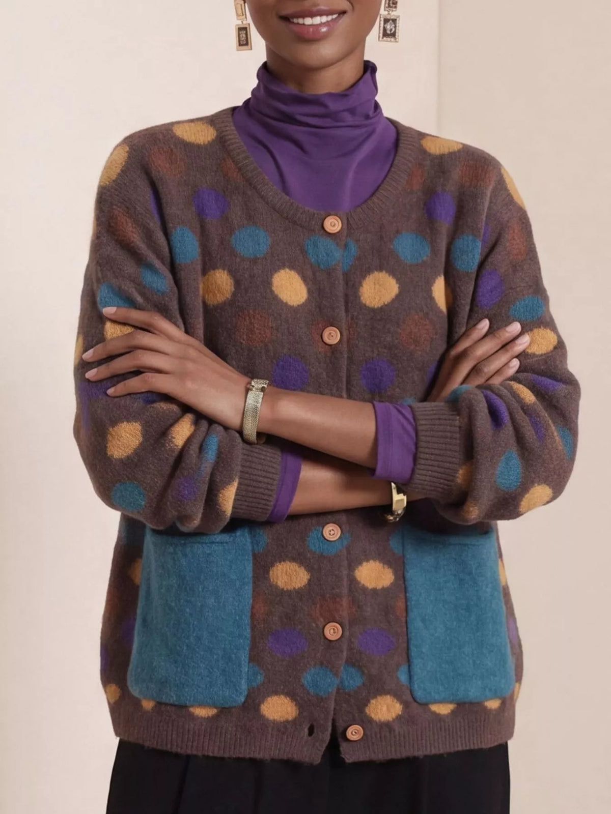 Plus size polka dot button-down cardigan from Trendsi, featuring a full size fit and classic design.