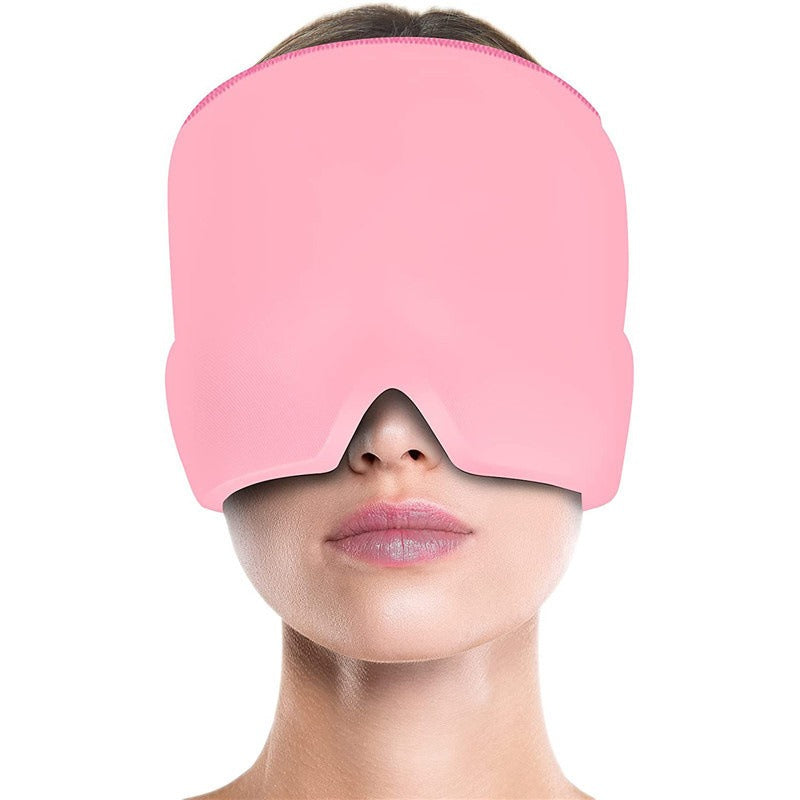 Solid pink migraine cap, pull-on style made of smooth fabric, covering the eyes and forehead.