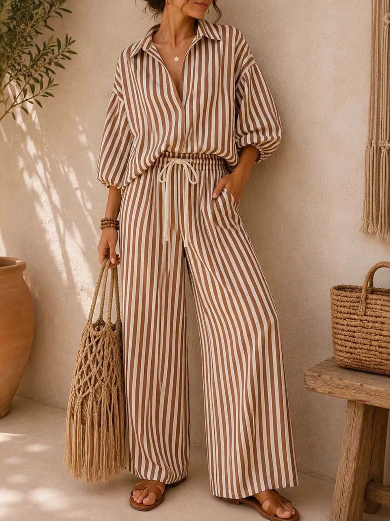 Plus size striped puff sleeve shirt and wide-leg drawstring pants set by Trendsi, featuring a stylish, comfortable matching outfit.