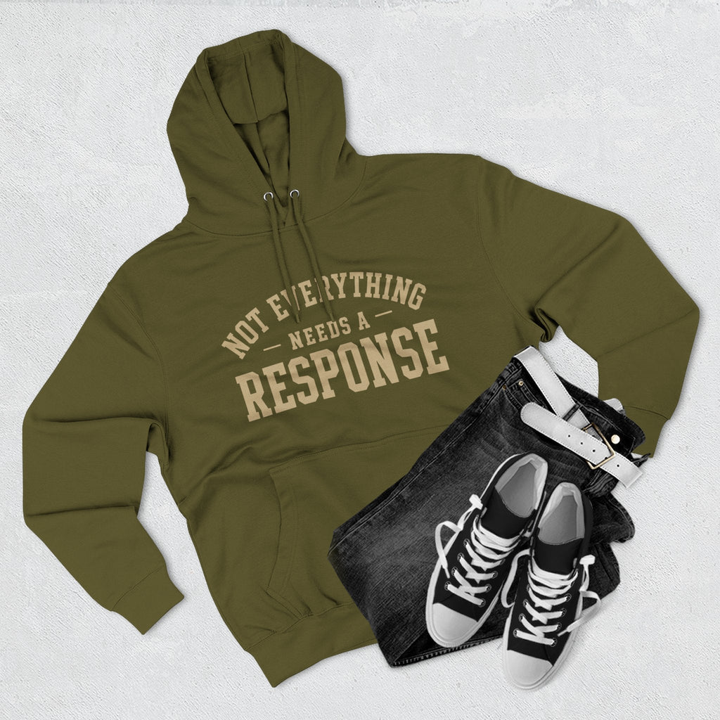 Black hoodie from Wear Your Worship's Not Everything Needs a Response collection with printed text design.
