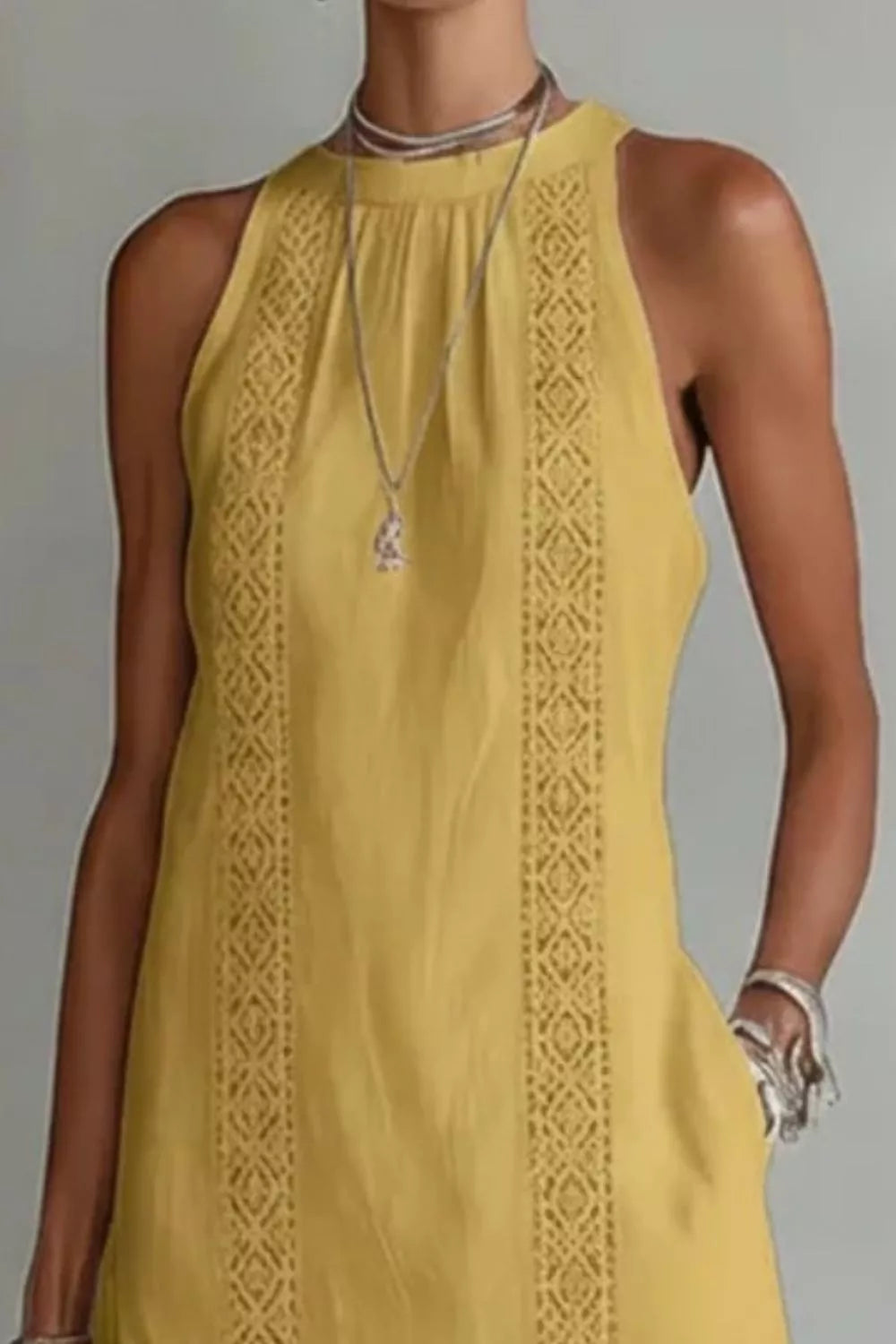 Women's sleeveless maxi dress with side slit and pockets by Plush Fashion Hub, flowing fabric, stylish and comfortable for summer wear.