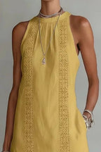 Women's sleeveless maxi dress with side slit and pockets by Plush Fashion Hub, flowing fabric, stylish and comfortable for summer wear.