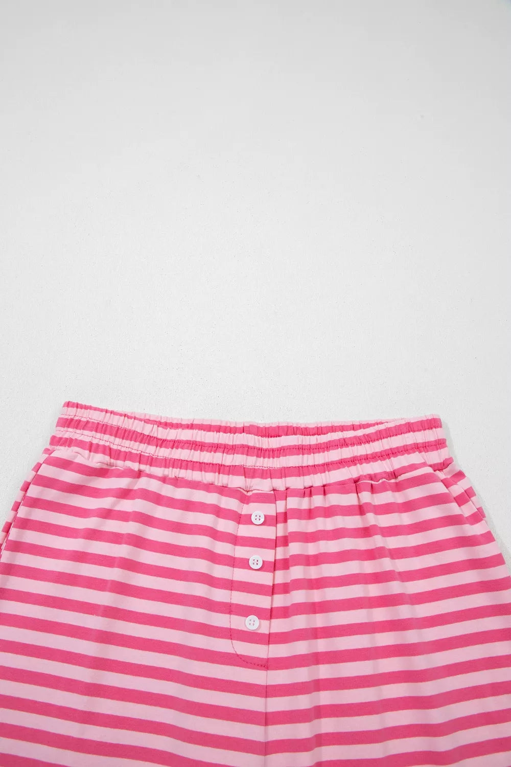 Stripe drop shoulder round neck top and buttoned straight pants two-piece set by Plush Fashion Hub, shown in a stylish casual outfit.