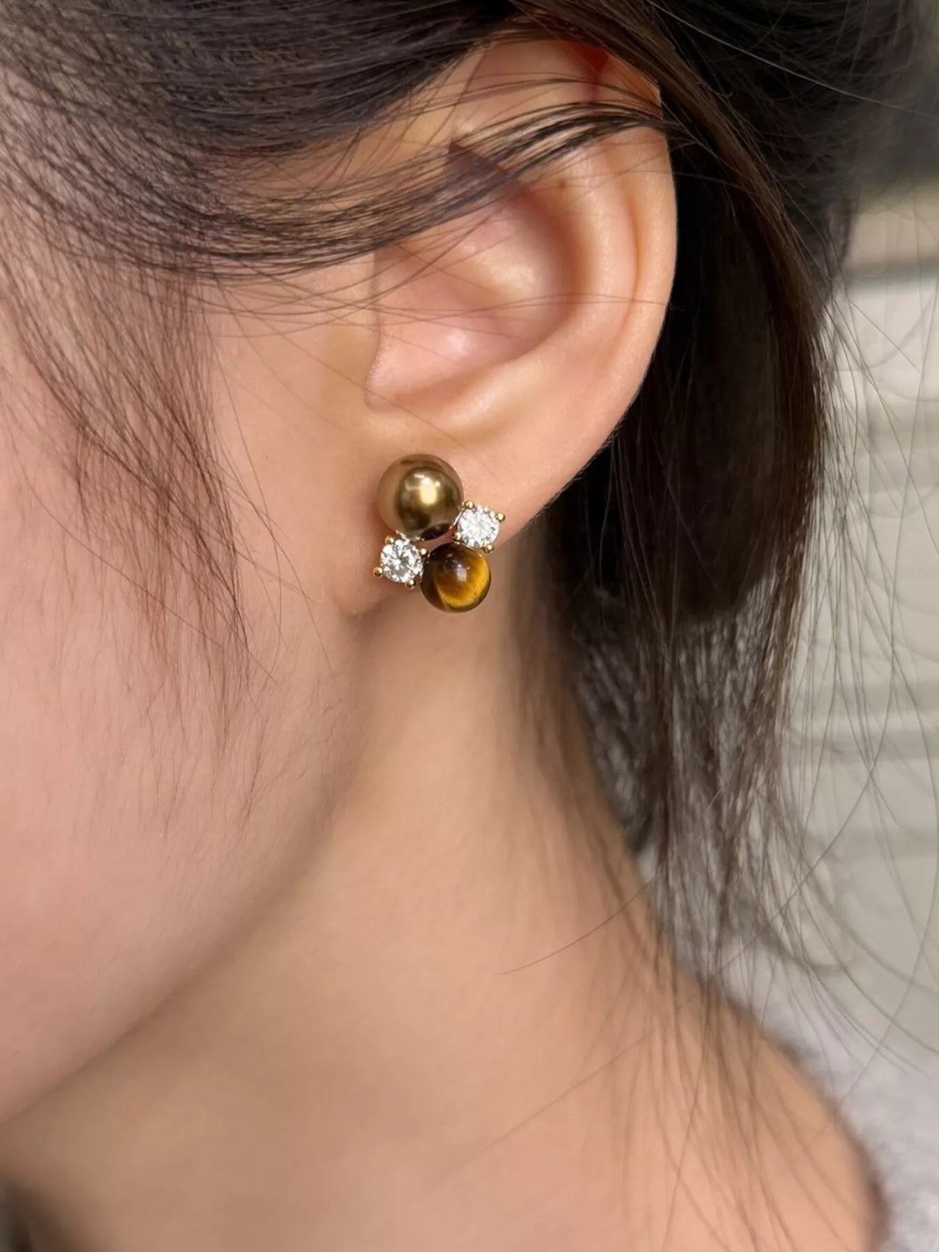 Tiger Eye stud earrings from Trendsi featuring polished, golden-brown gemstone studs with silver posts.