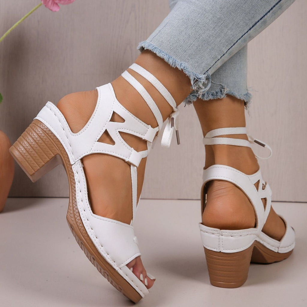 Women's lace-up block heel sandals with strappy design and mid-height heel, stylish shoes by Trendsi.