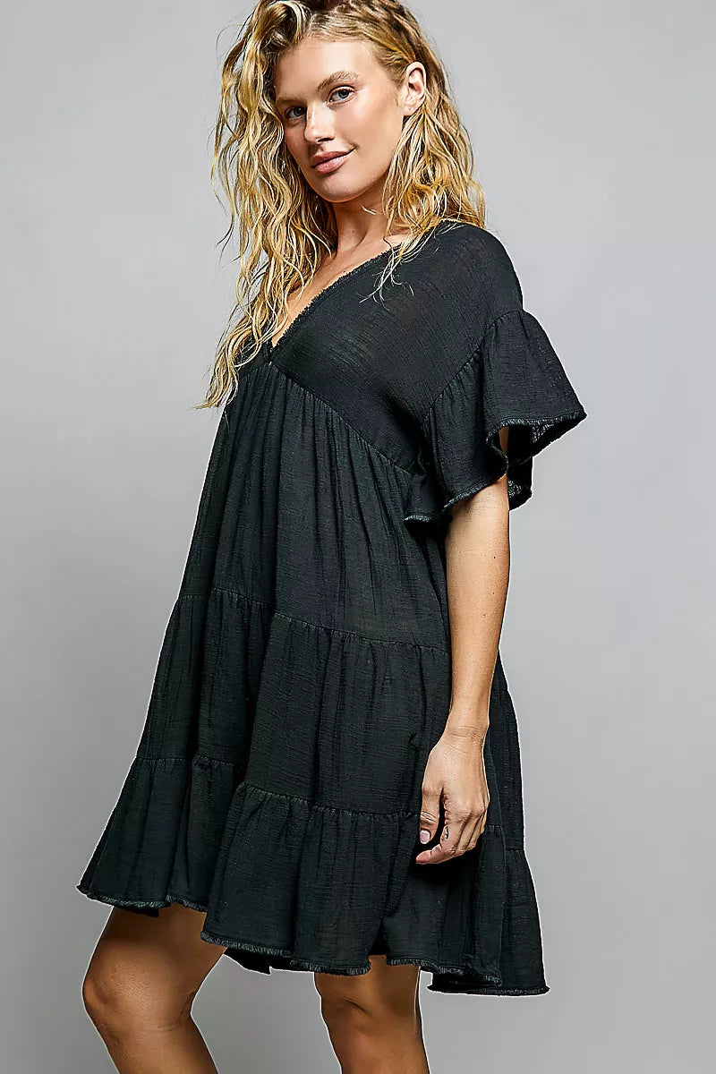 Cotton ruffle shirred v-neck short sleeve dress by Plush Fashion Hub, featuring a feminine design with ruffled details and a relaxed fit.