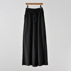 Women’s cotton linen yoga pants by Bella Mia featuring artistic stone wash, wide-leg style, perfect for casual spring and summer wear.
