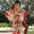 Light chiffon beach jacket with loose fit, worn over a bikini, featuring a breezy style for women’s sun protection and stylish outerwear.