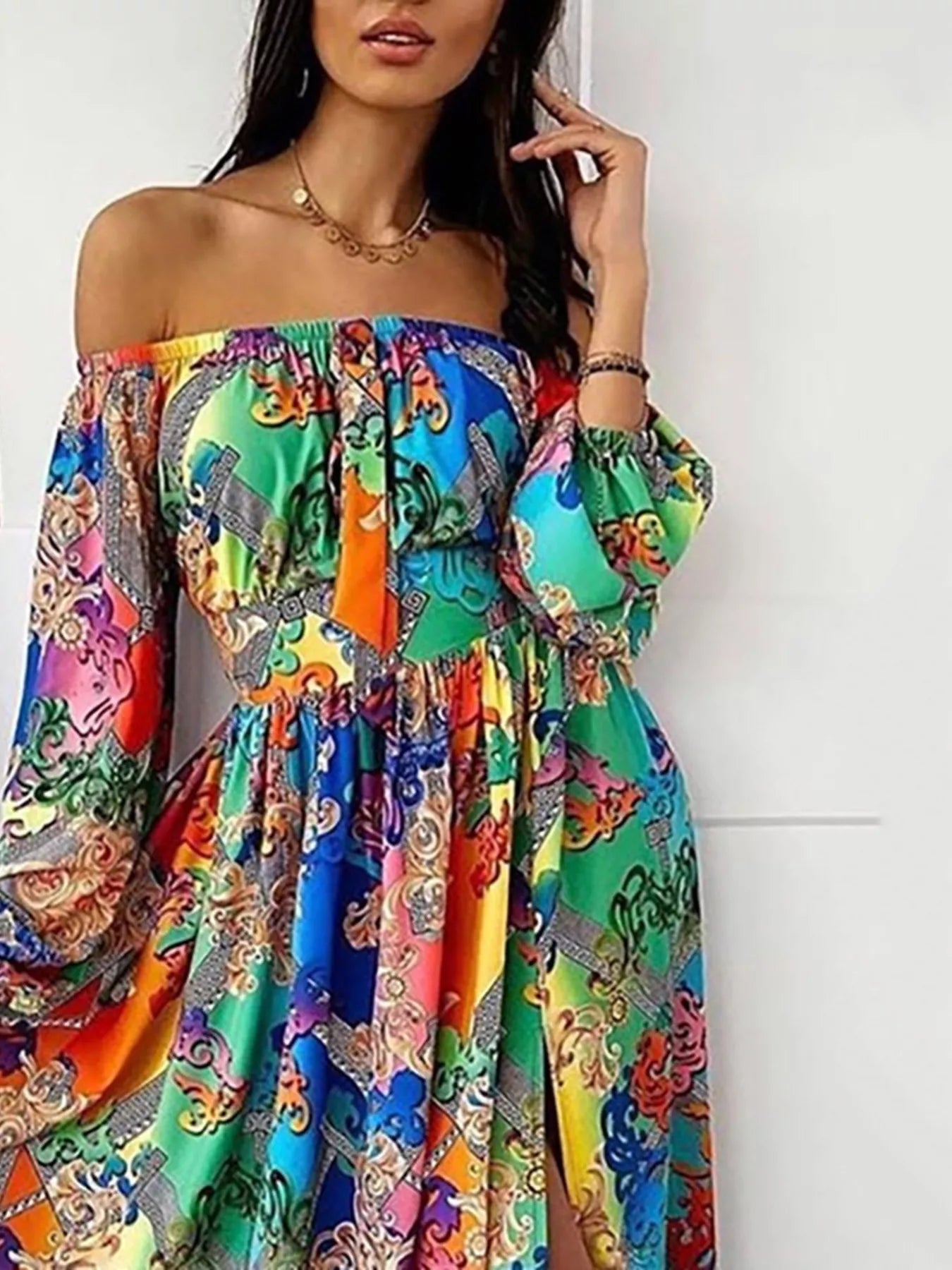 Plush Fashion Hub off-shoulder printed maxi dress with slit, flowing fabric, and vibrant floral design, perfect for summer wear.