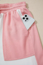 Two-tone color block patchwork tee and drawstring loose pant set by Trendsi, featuring casual, stylish matching clothing for women.