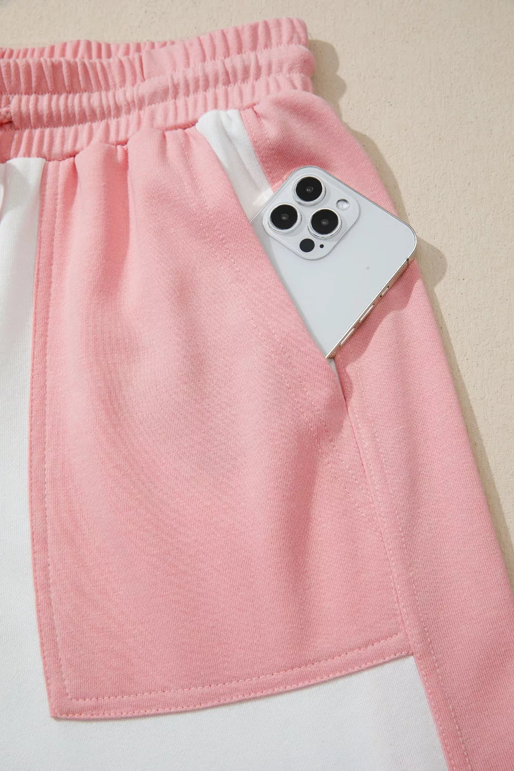 Two-tone color block patchwork tee and drawstring loose pant set by Trendsi, featuring casual, stylish matching clothing for women.