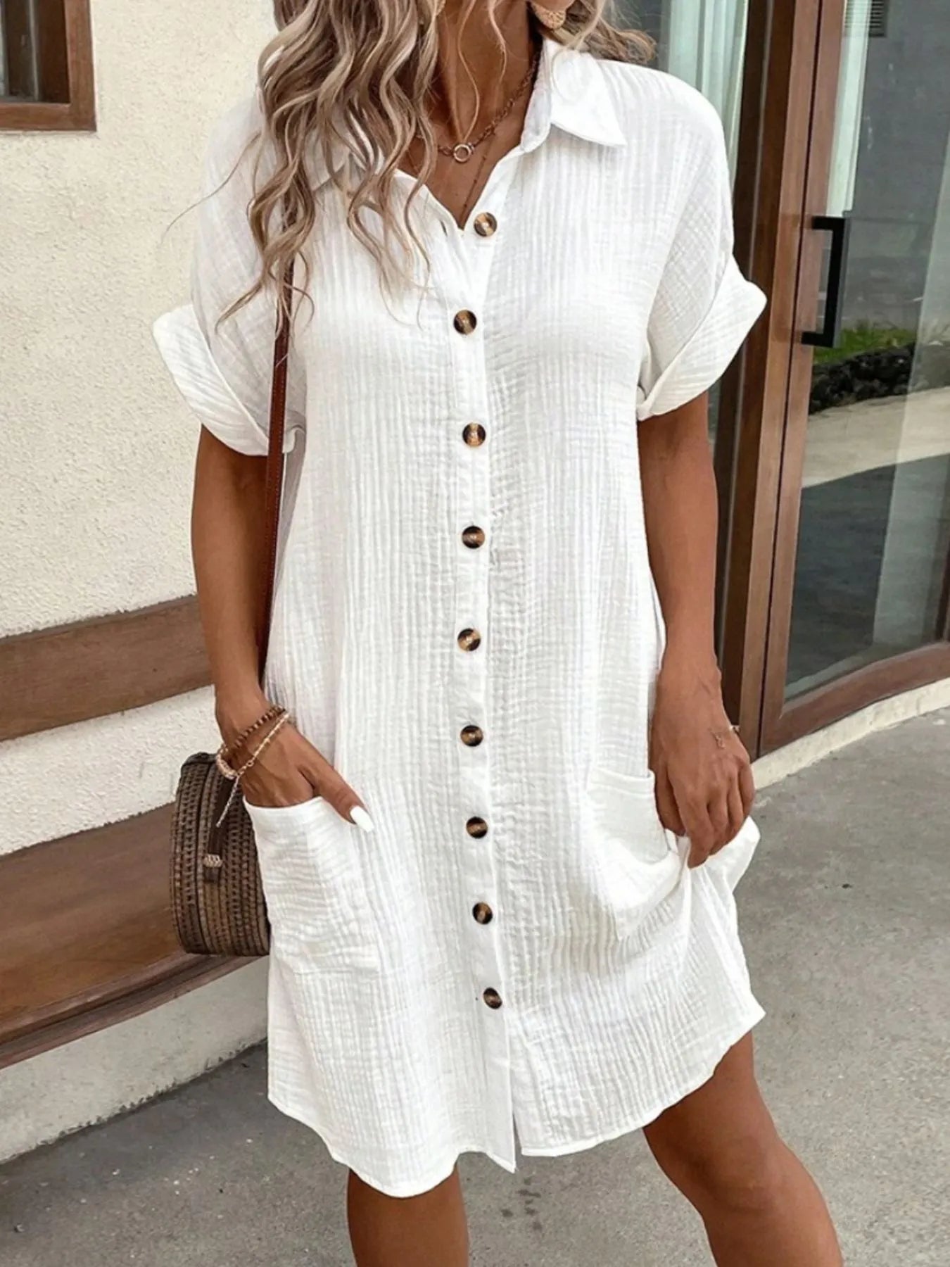 Casual Plush Fashion Hub button-down shirt dress with pockets, featuring a relaxed fit and stylish design, shown on a model.