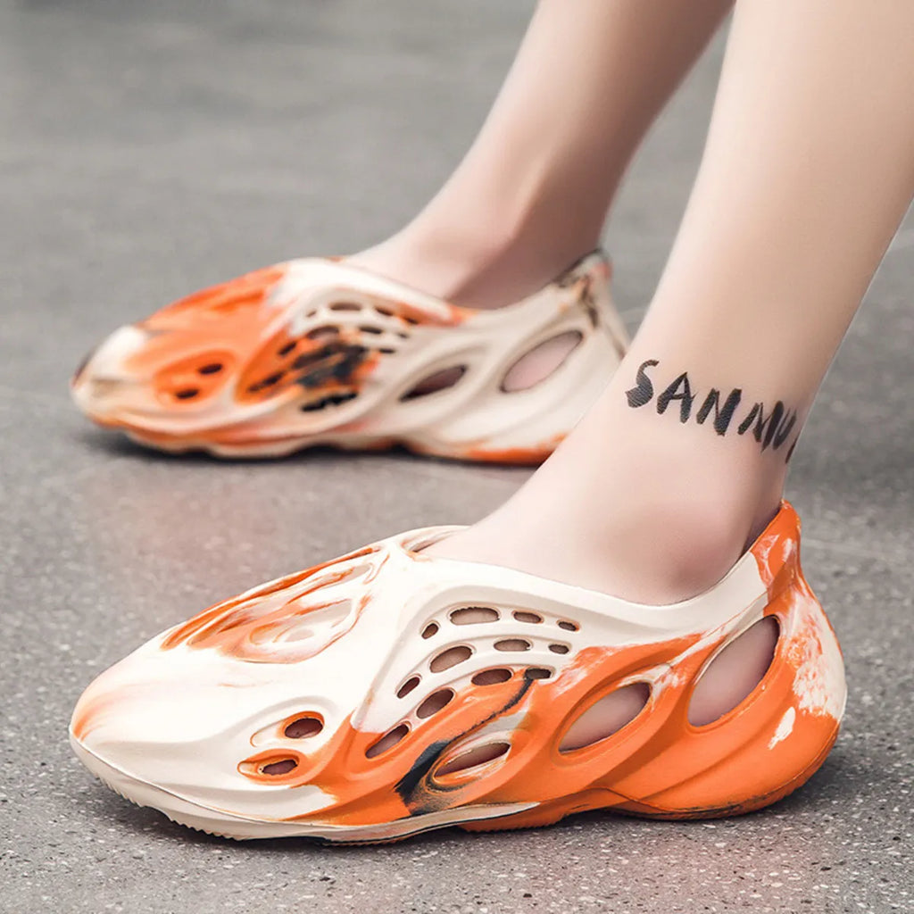 Trendsi hollow-out flat sandals with open toe design and stylish cutouts, showcasing lightweight footwear for casual summer wear.
