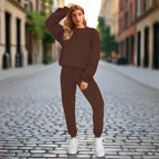 Women's solid color round neck sweatshirt and pants set by Plush Fashion Hub, casualwear with comfortable, relaxed fit.