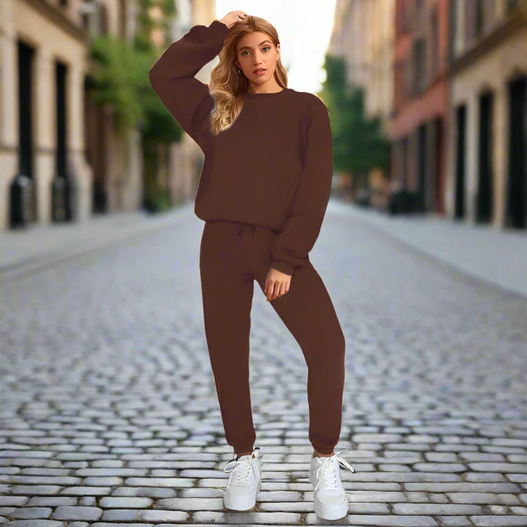 Women's solid color round neck sweatshirt and pants set by Plush Fashion Hub, casualwear with comfortable, relaxed fit.