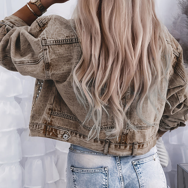 Women’s studded denim jacket by Plush Fashion Hub featuring silver studs, classic blue denim, and a stylish collar design.