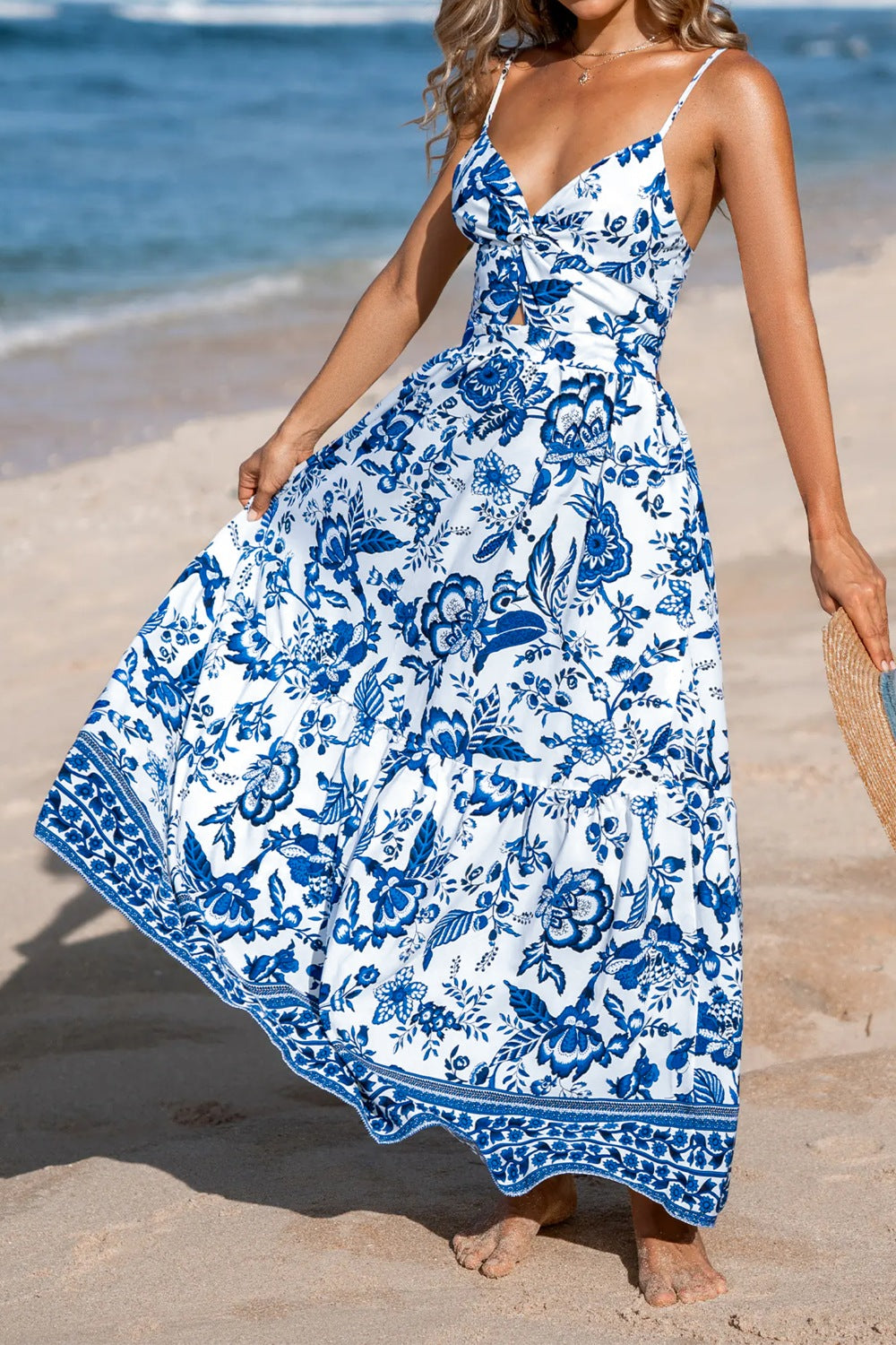 Floral print twisted front backless maxi dress with cutout details, stylish and flowy, ideal for summer occasions.