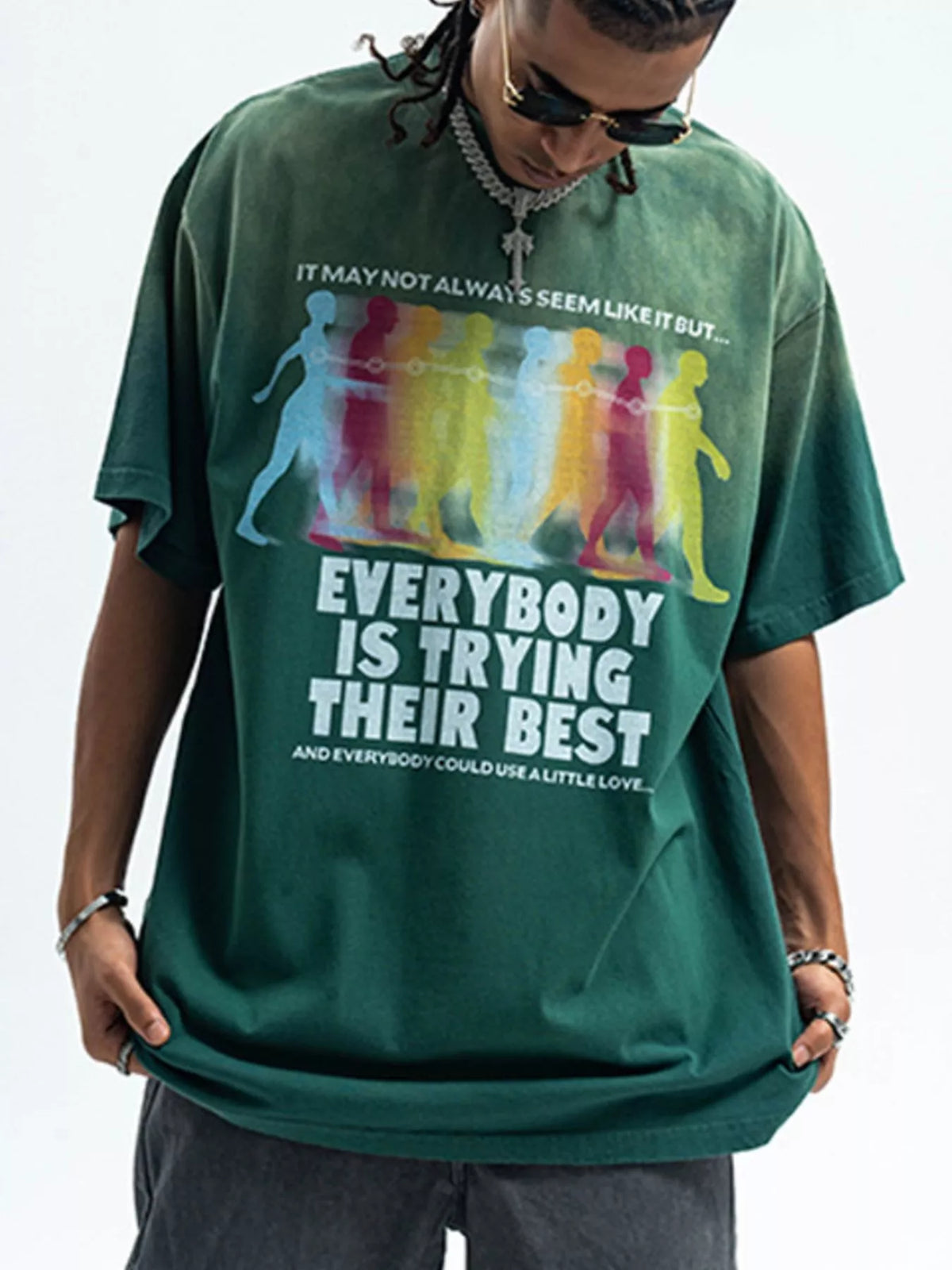 Men's graphic round neck short sleeve T-shirt by Trendsi featuring a bold, colorful design on soft cotton fabric.
