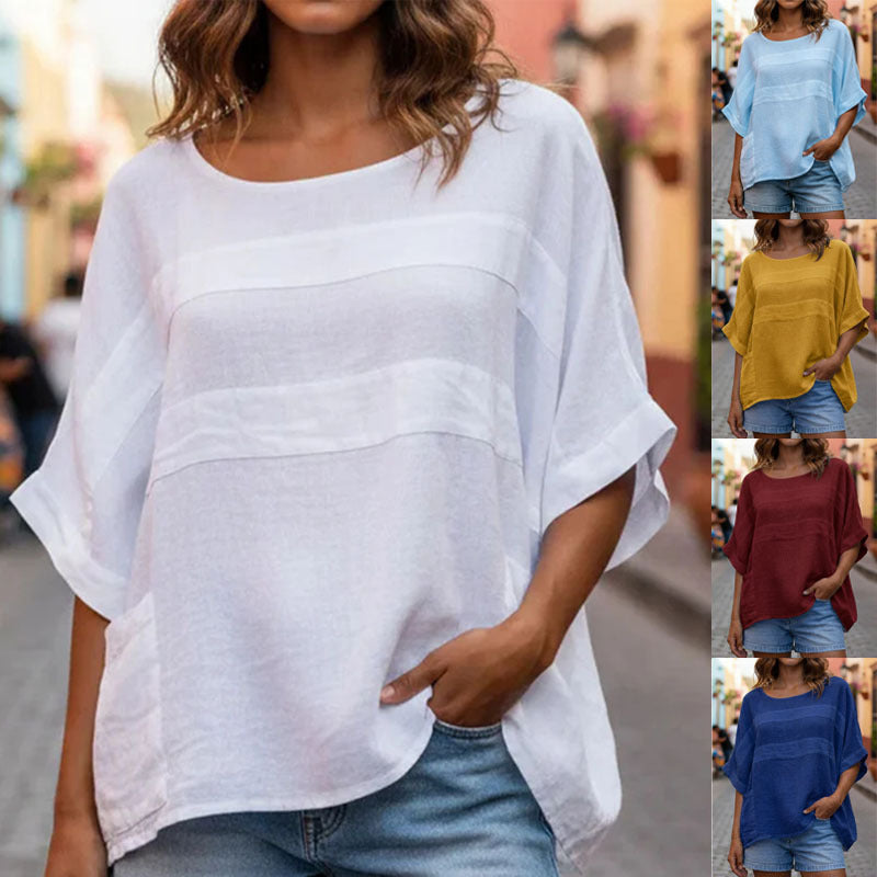 Loose-fitting crew neck top with three-quarter sleeves from Plush Fashion Hub, shown in a soft, casual style.