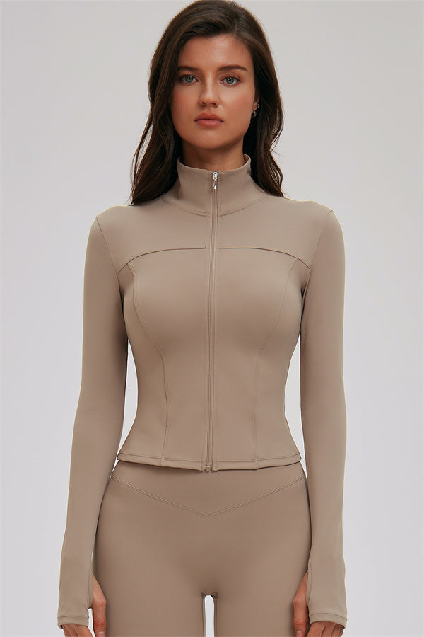 Fitglutes activewear three-piece set including a kinetic zip jacket, cross back sports bra, and leggings for workout and gym.