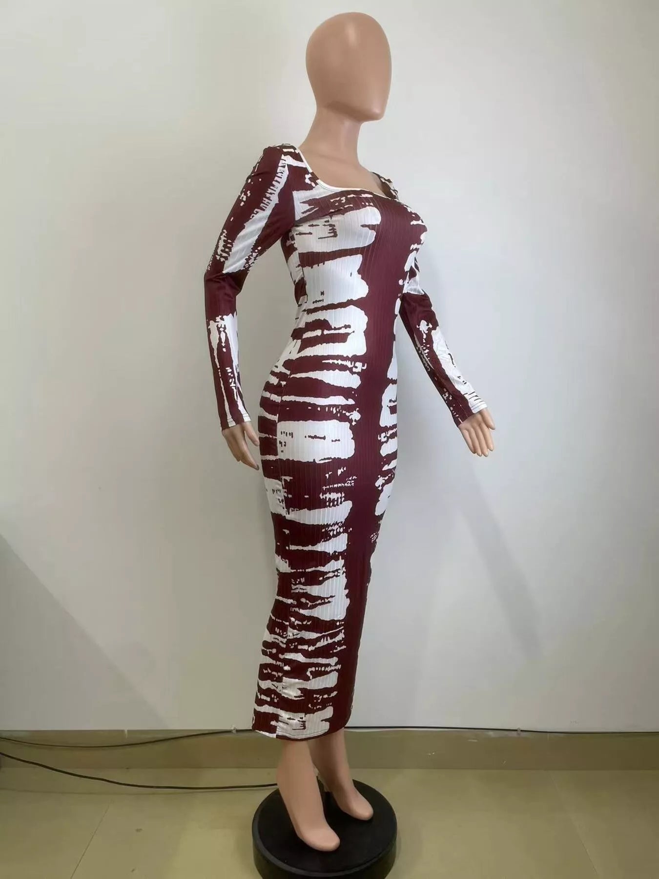 Colorful tie-dye long sleeve maxi dress by Shopimist with a flowing silhouette and vibrant pattern, perfect for casual or boho style.