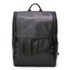 Black leather computer backpack with first layer leather construction, featuring multiple compartments and adjustable straps.