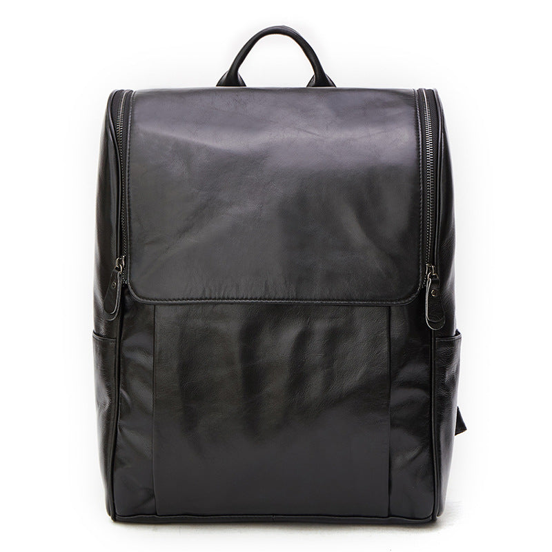 Black leather computer backpack with first layer leather construction, featuring multiple compartments and adjustable straps.